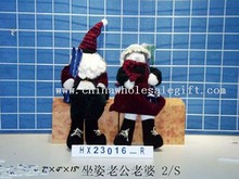 sittingsanta claus &woman 2/s images