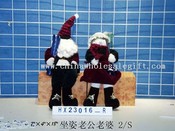 sittingsanta claus &woman 2/s images